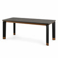 Mesa de cerámica negra con patas de metal y detalles en madera 180cm
