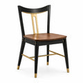 Silla de madera y metal negro con detalles dorados