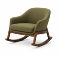 Sillón mecedora de madera y tela verde